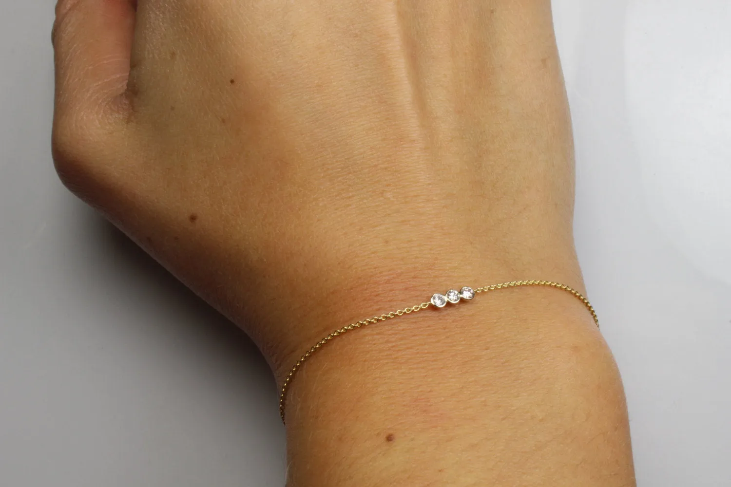 14K Gold Three Stone Diamond Bezel Bracelet