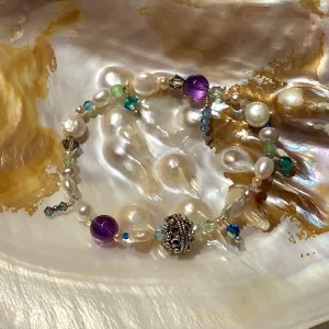 Arpaia 7" one of a kind stretch bracelet with amethyst, cultured pearls, glass, Swarovski crystal, and artisan sterling silver.