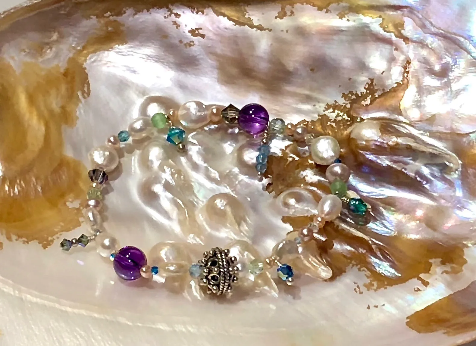 Arpaia 7" one of a kind stretch bracelet with amethyst, cultured pearls, glass, Swarovski crystal, and artisan sterling silver.