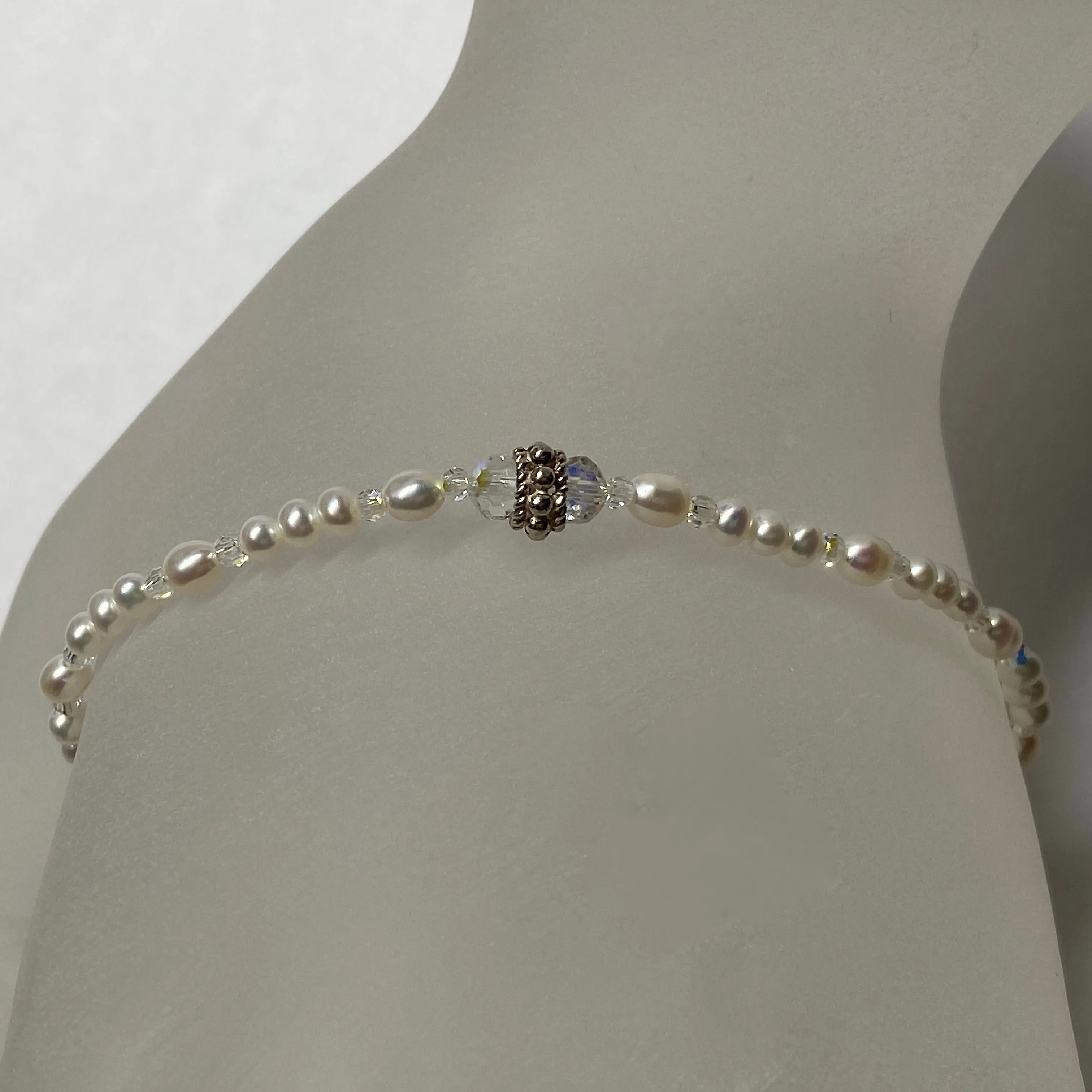 Arpaia 7" stretch bracelet with white baby freshwater cultured pearls and Swarovski crystal beads