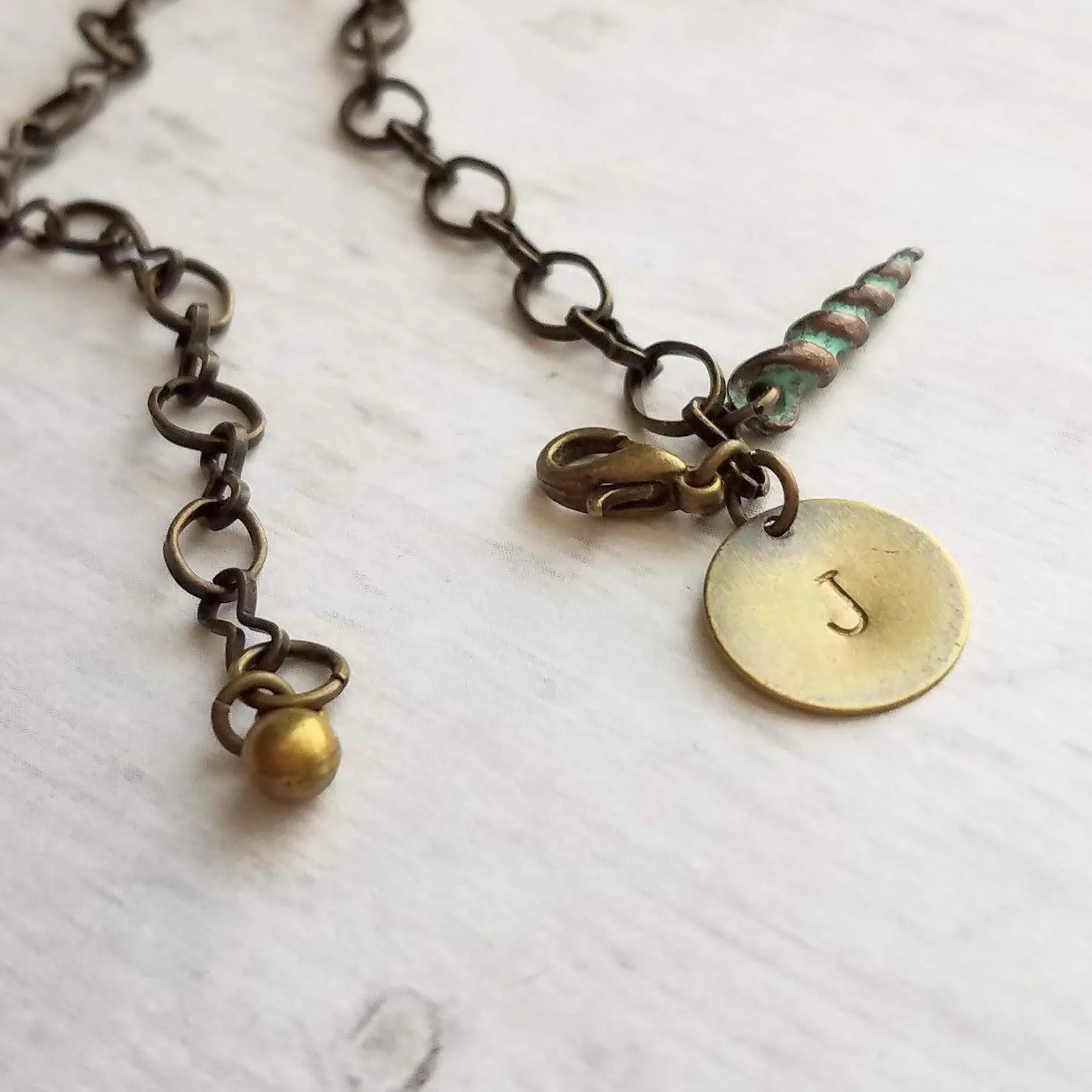 Beach Bracelet, antique brass bracelet, bronze bracelet, seashell bracelet, initial bracelet, shell charm bracelet, letter bracelet, spiral
