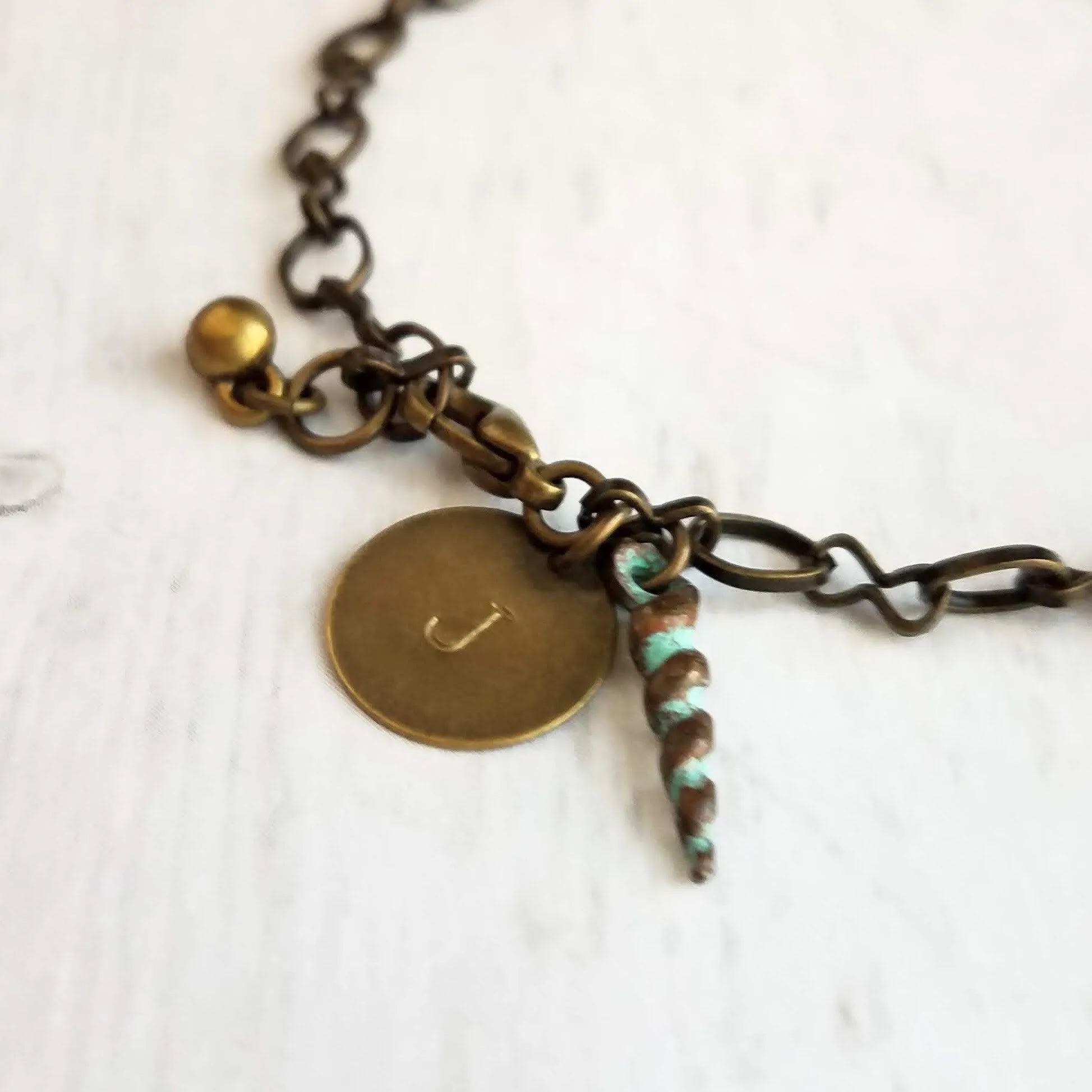 Beach Bracelet, antique brass bracelet, bronze bracelet, seashell bracelet, initial bracelet, shell charm bracelet, letter bracelet, spiral