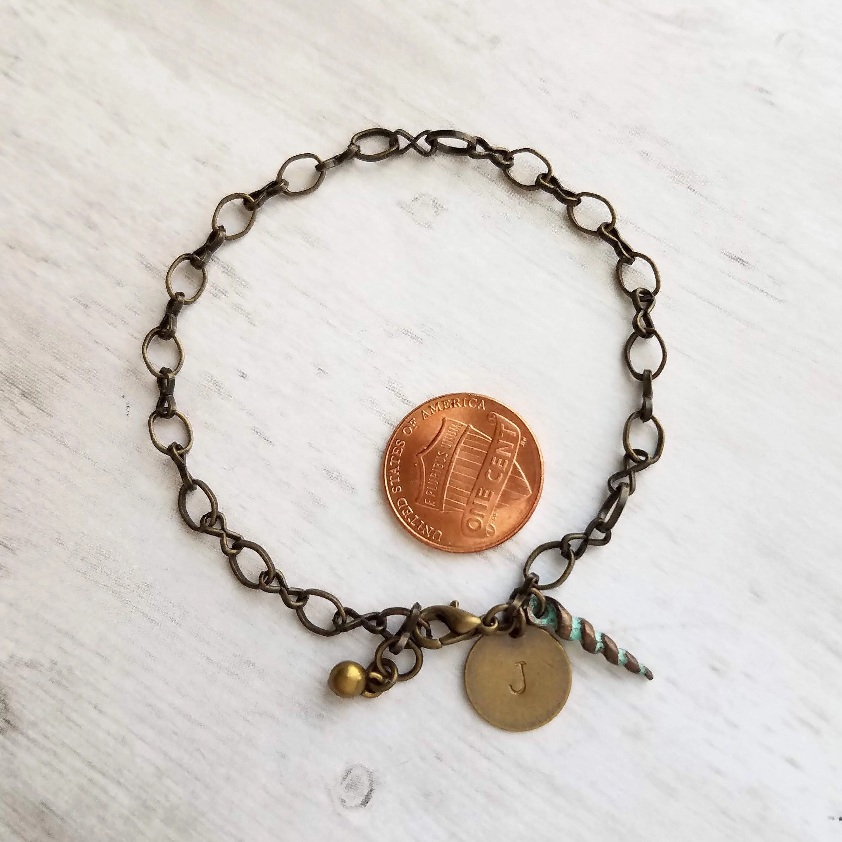 Beach Bracelet, antique brass bracelet, bronze bracelet, seashell bracelet, initial bracelet, shell charm bracelet, letter bracelet, spiral
