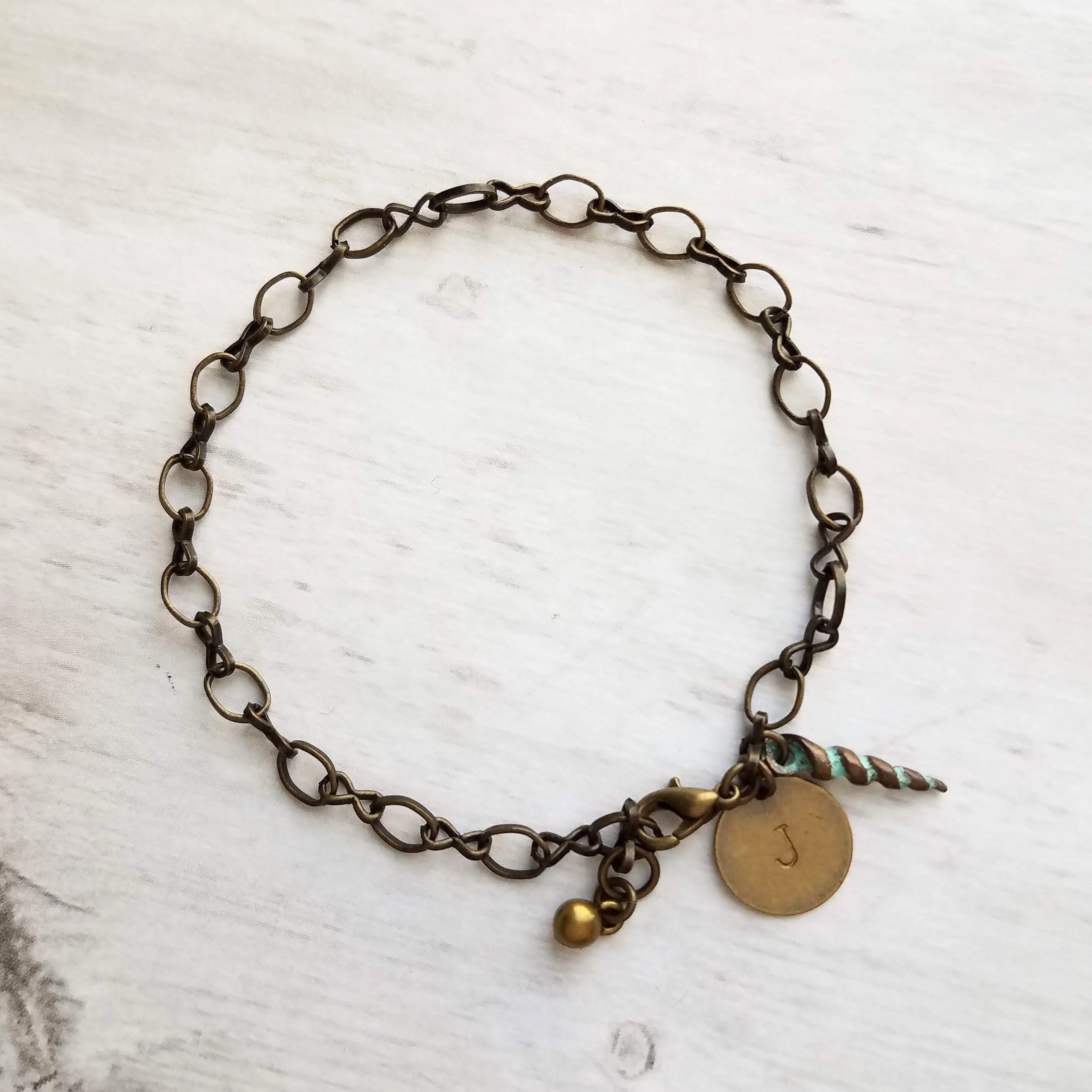 Beach Bracelet, antique brass bracelet, bronze bracelet, seashell bracelet, initial bracelet, shell charm bracelet, letter bracelet, spiral