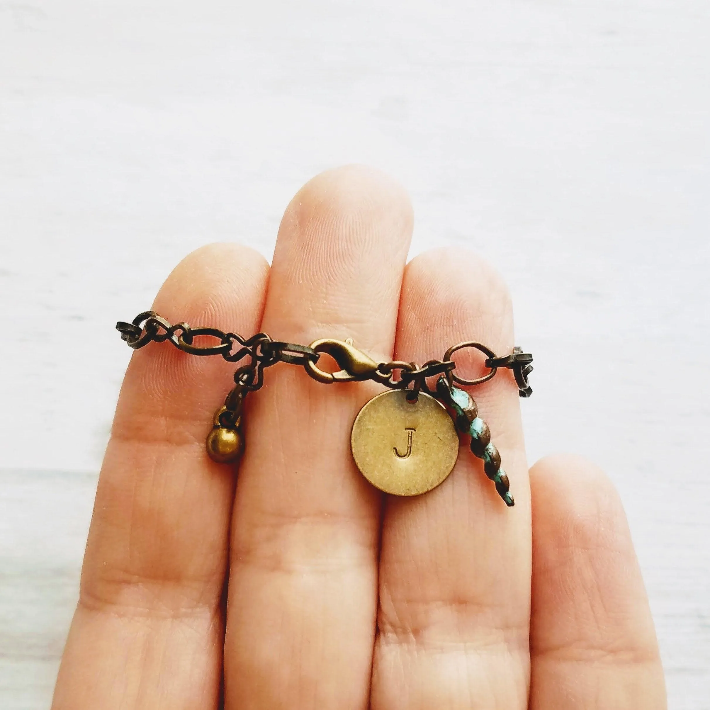 Beach Bracelet, antique brass bracelet, bronze bracelet, seashell bracelet, initial bracelet, shell charm bracelet, letter bracelet, spiral