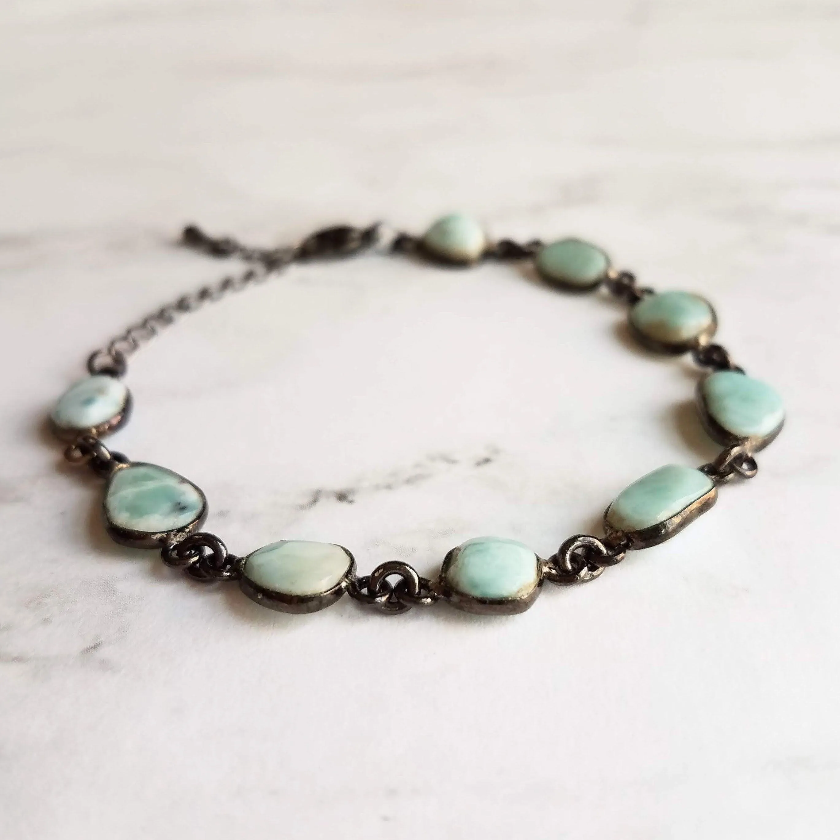 Blue Larimar Bracelet - shiny black gunmetal bezel frames, small organically shaped oval gemstones, aqua genuine stone adjustable chain