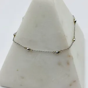 Delicate White Gold Beads Linked in a Golden Chain