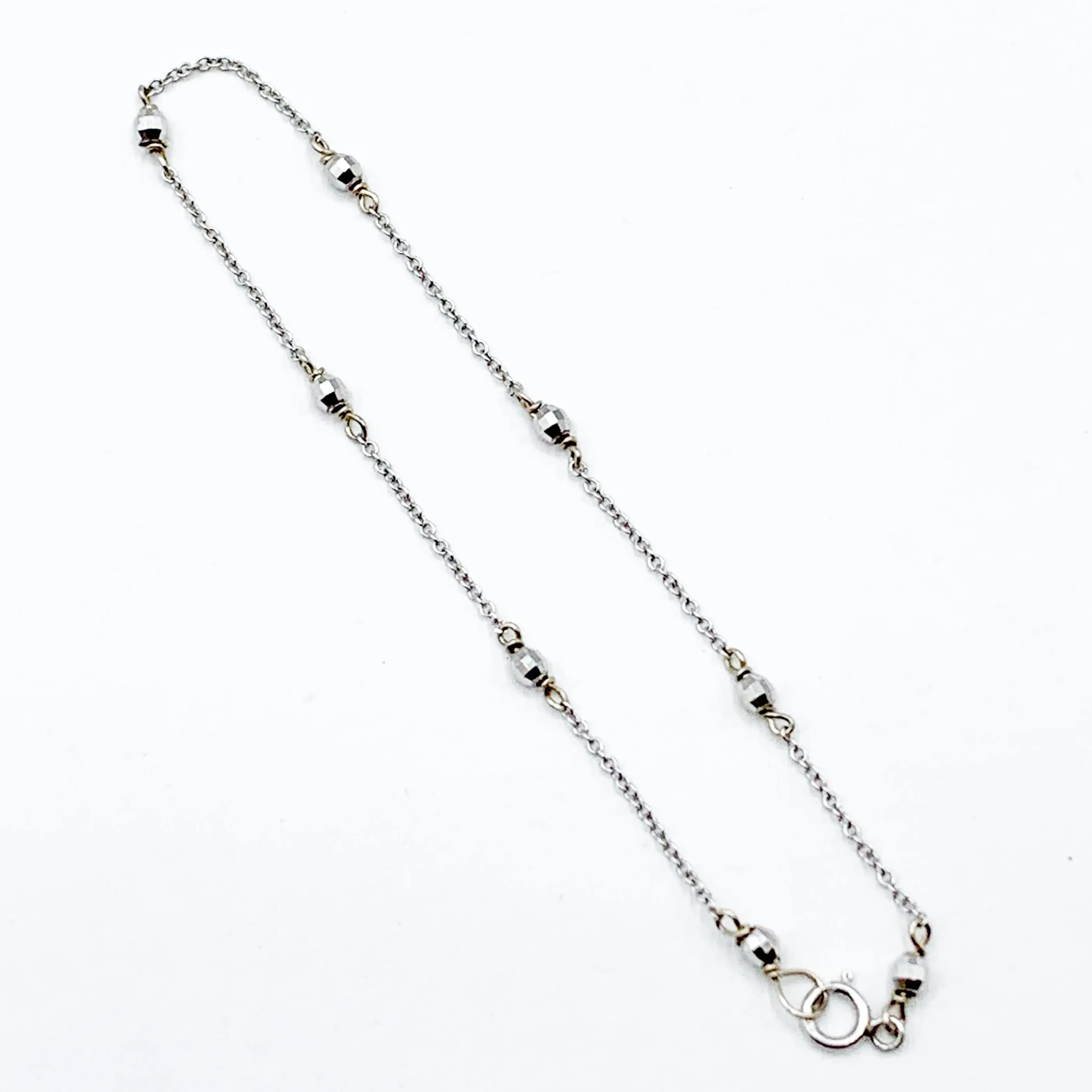 Delicate White Gold Beads Linked in a Golden Chain
