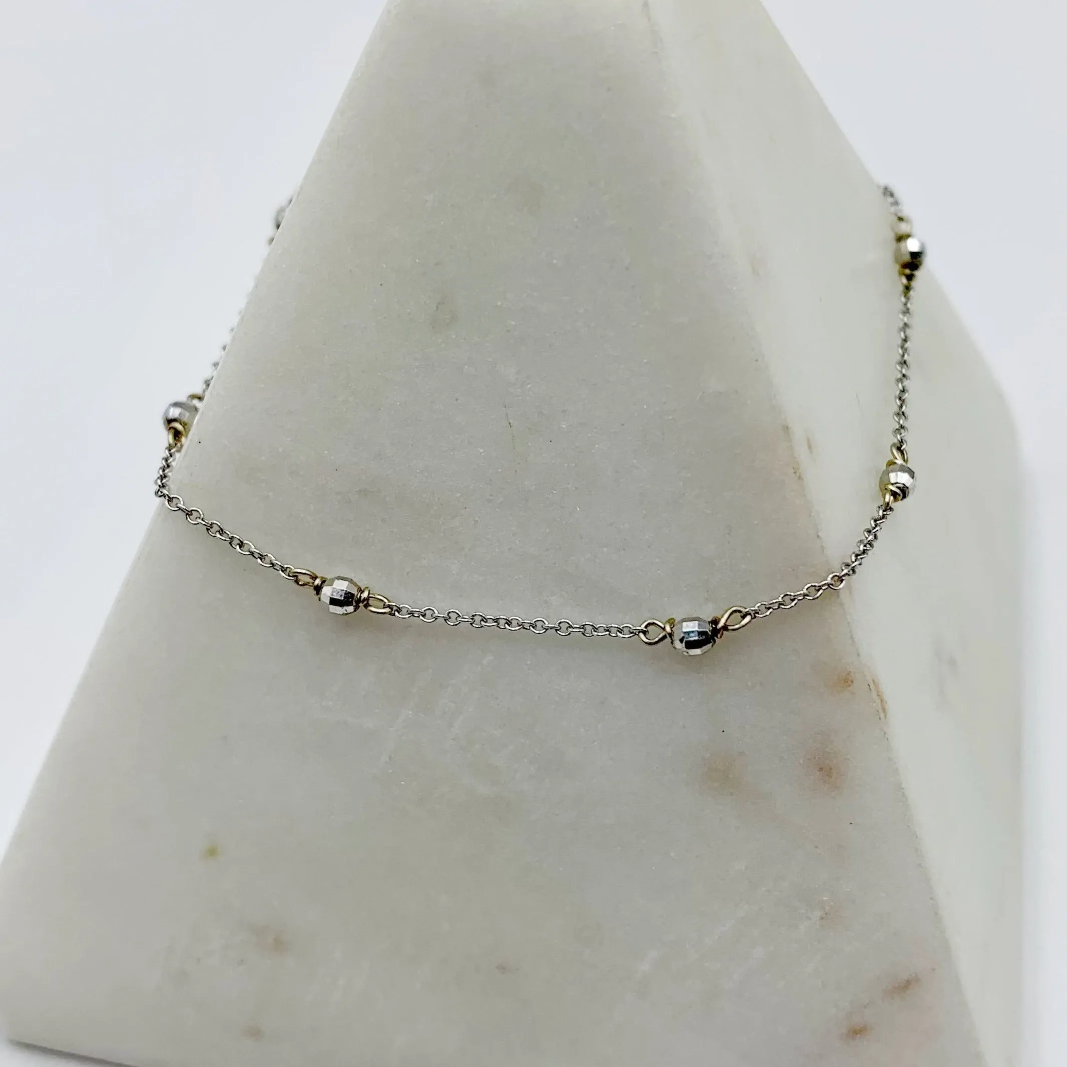Delicate White Gold Beads Linked in a Golden Chain