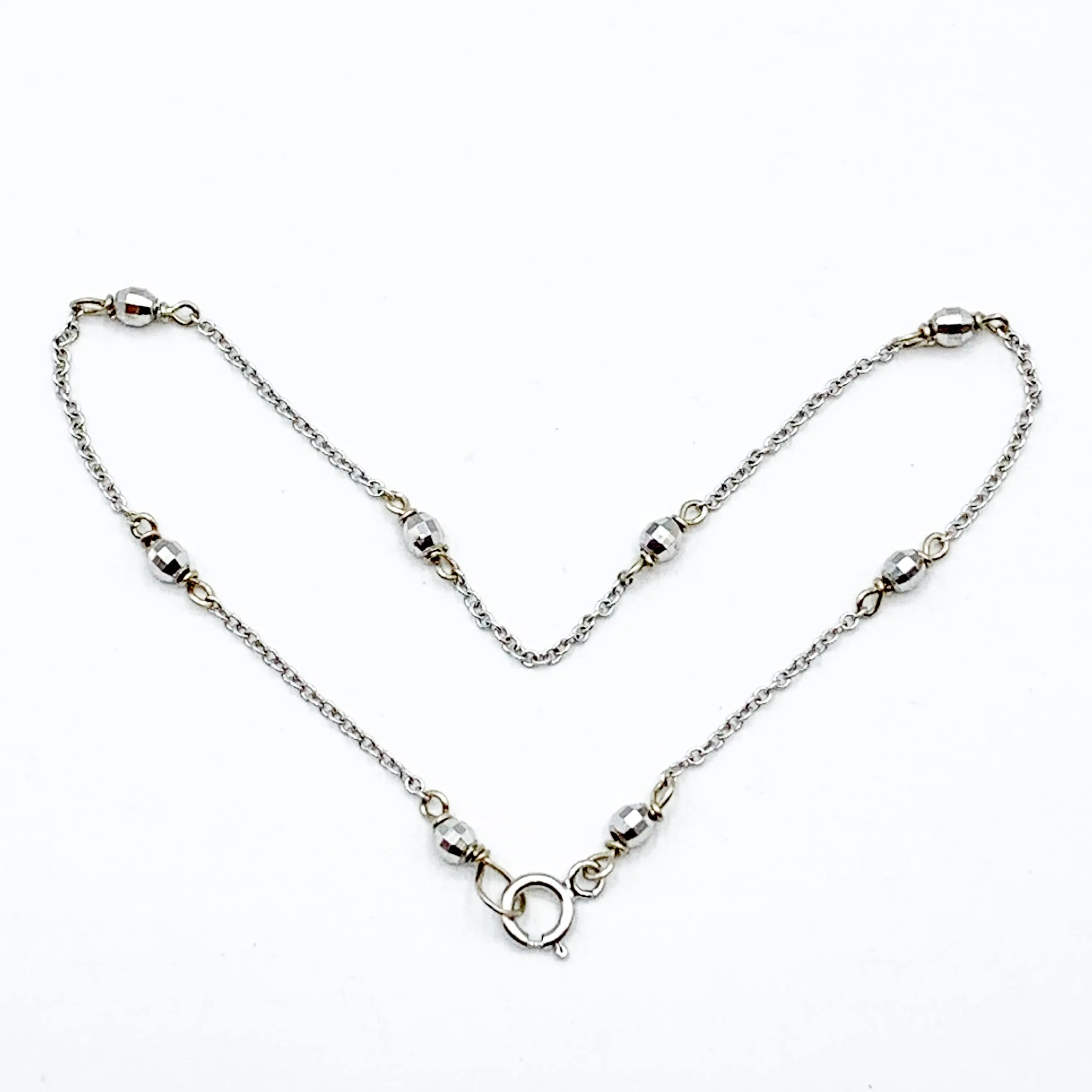 Delicate White Gold Beads Linked in a Golden Chain