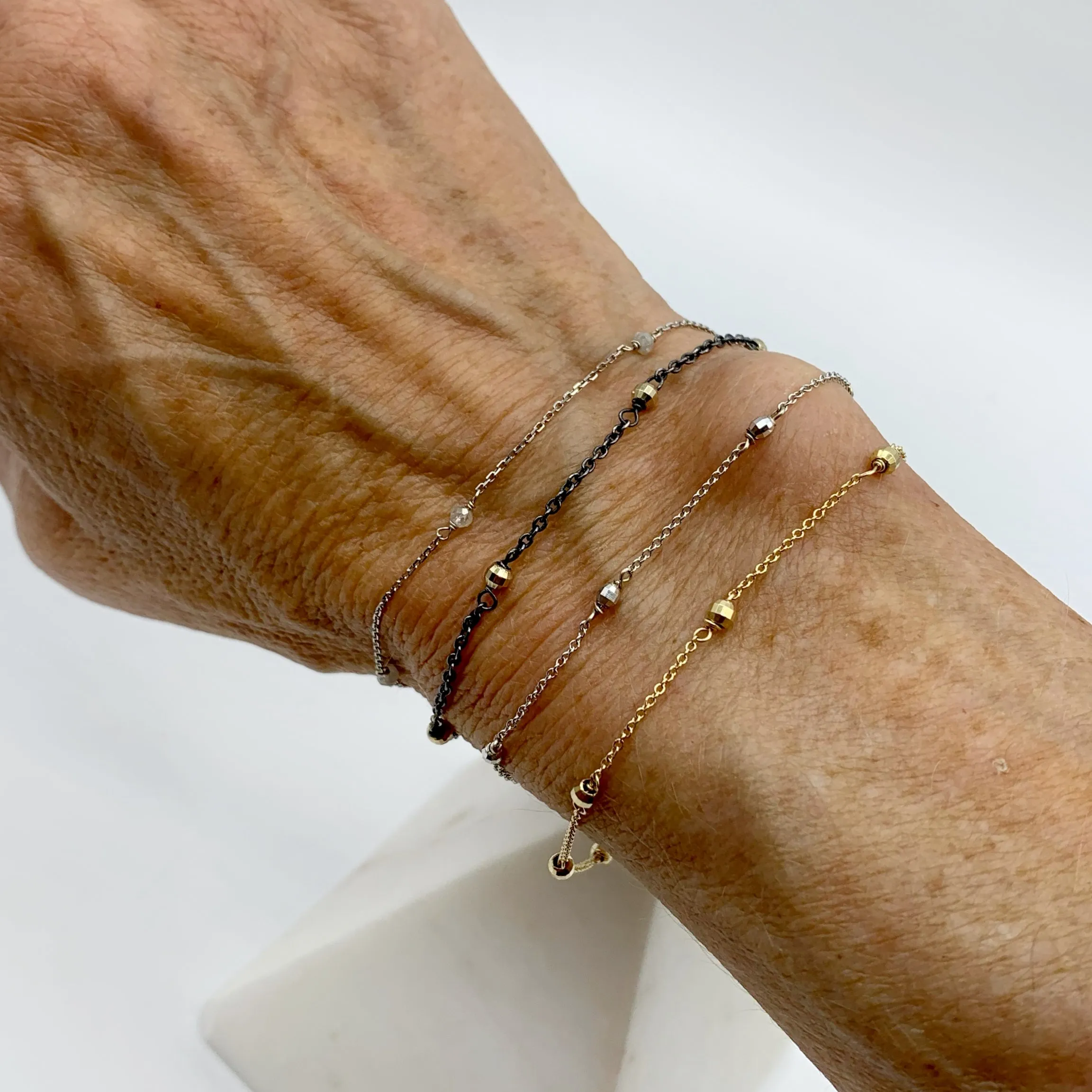 Delicate White Gold Beads Linked in a Golden Chain