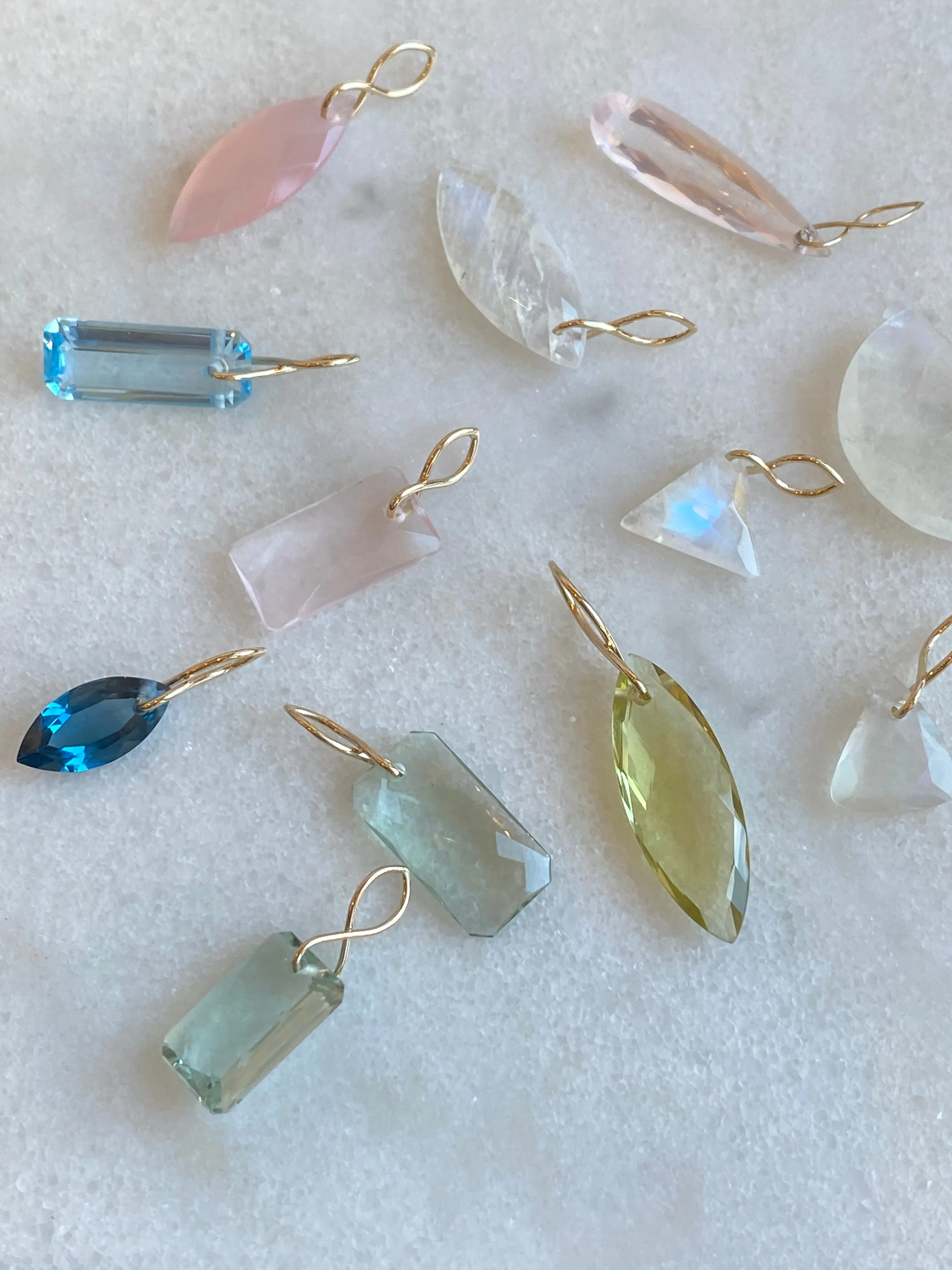Faceted Half Moon Moonstone on a 14k yellow gold infinity bale