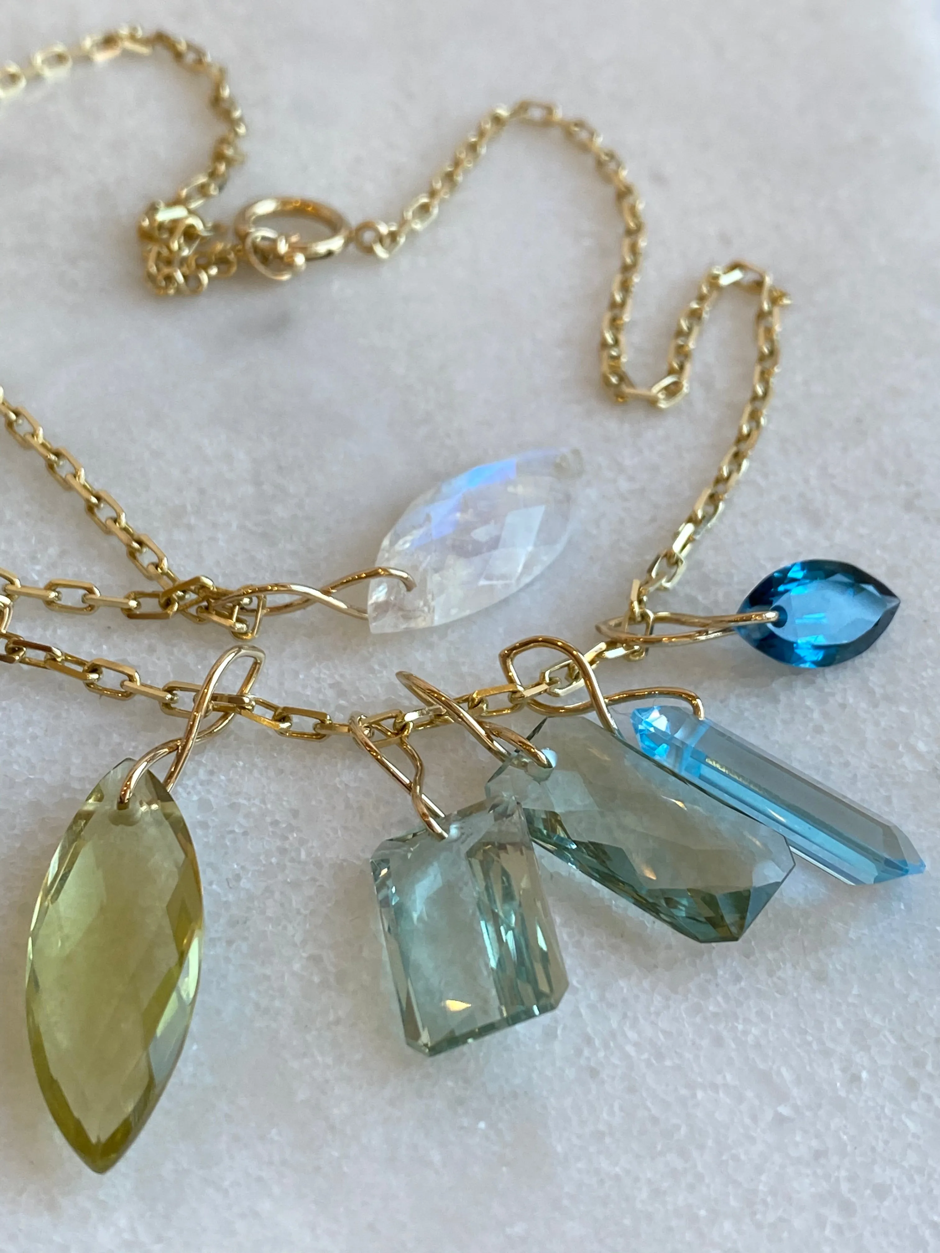 Faceted Marquise Citrine on a 14k yellow gold infinity bale