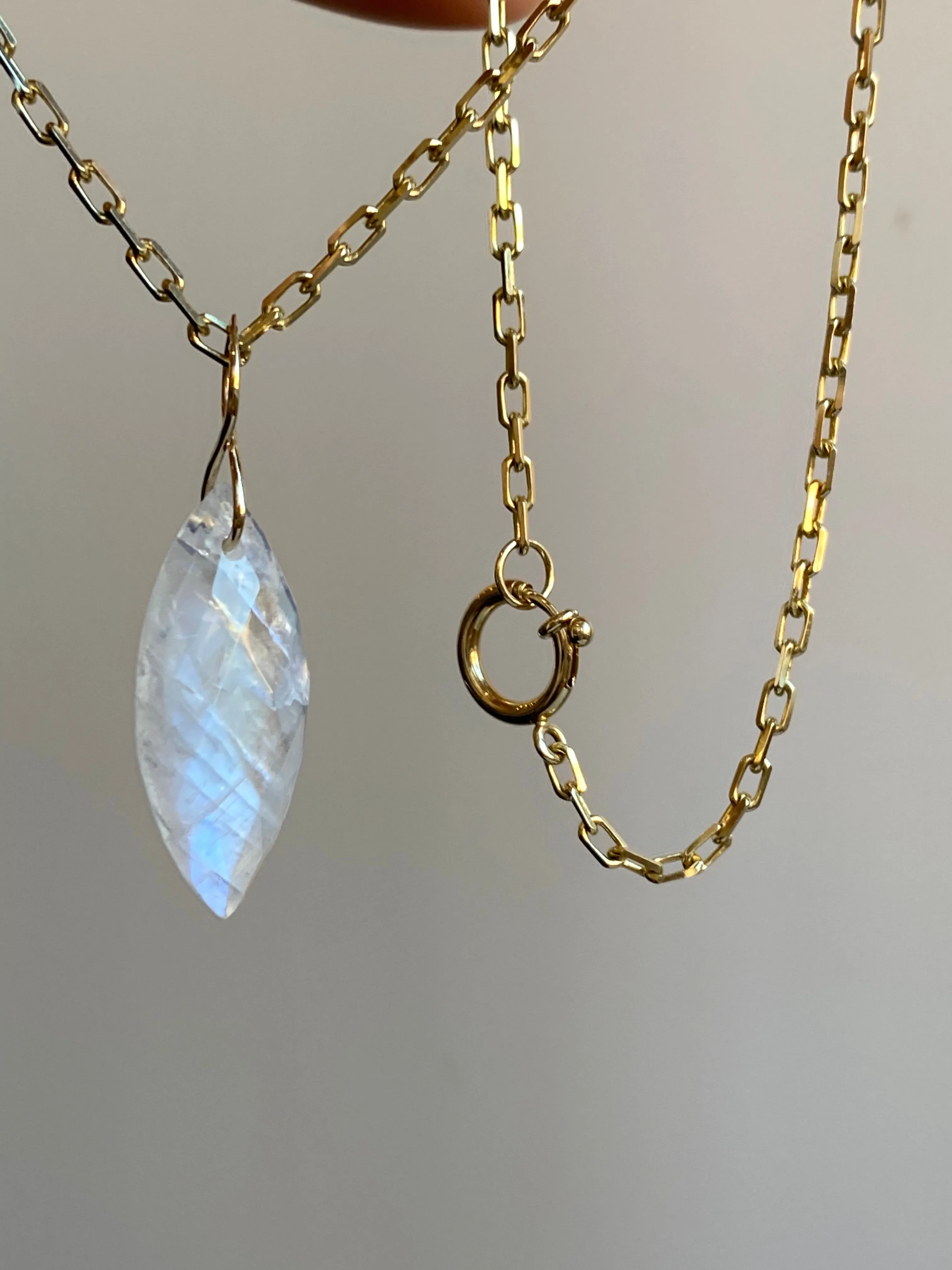 Faceted Marquise Moonstone on a 14k Yellow Gold Infinity Bale