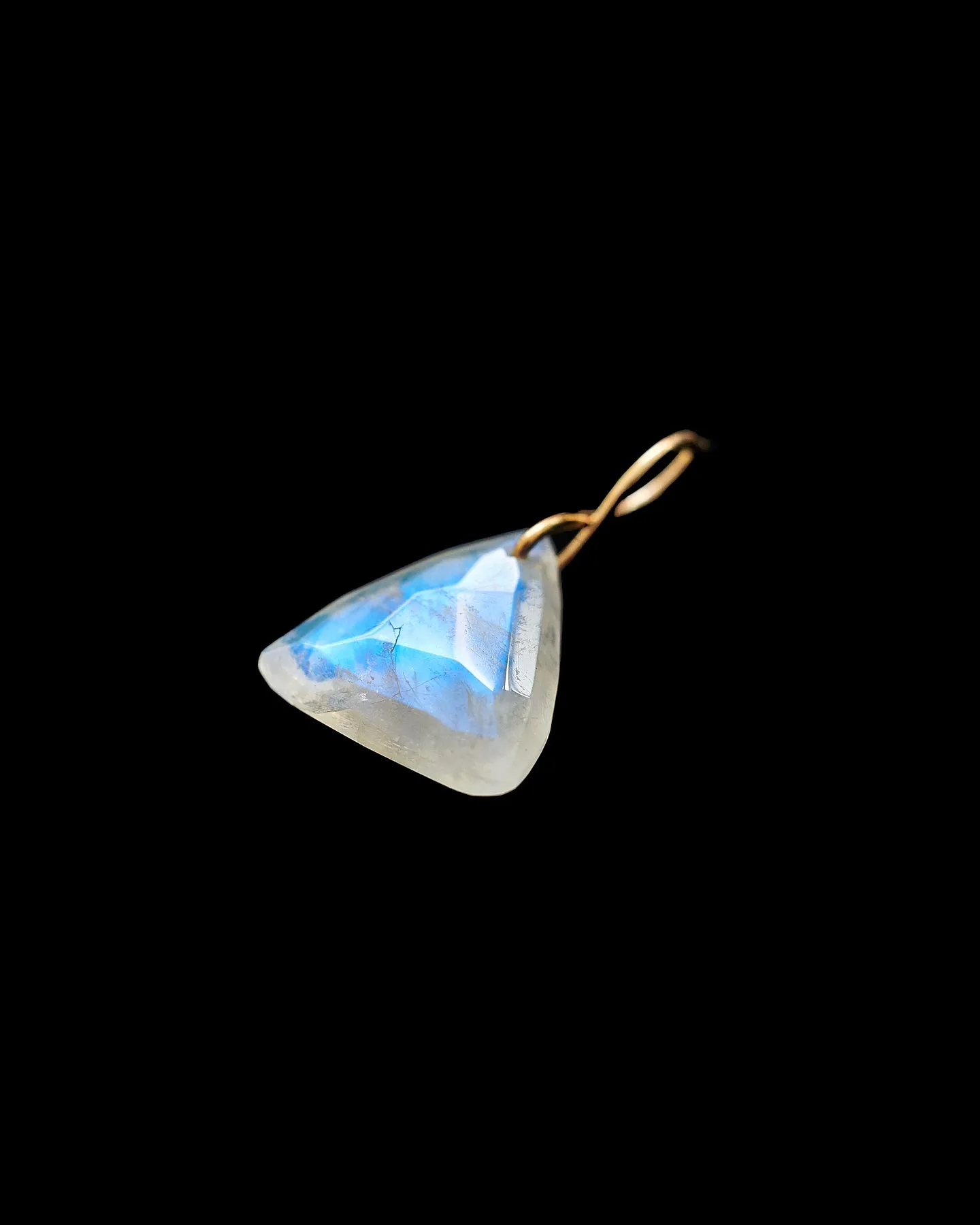 Faceted Trillion Moonstone on a 14k yellow gold infinity bale