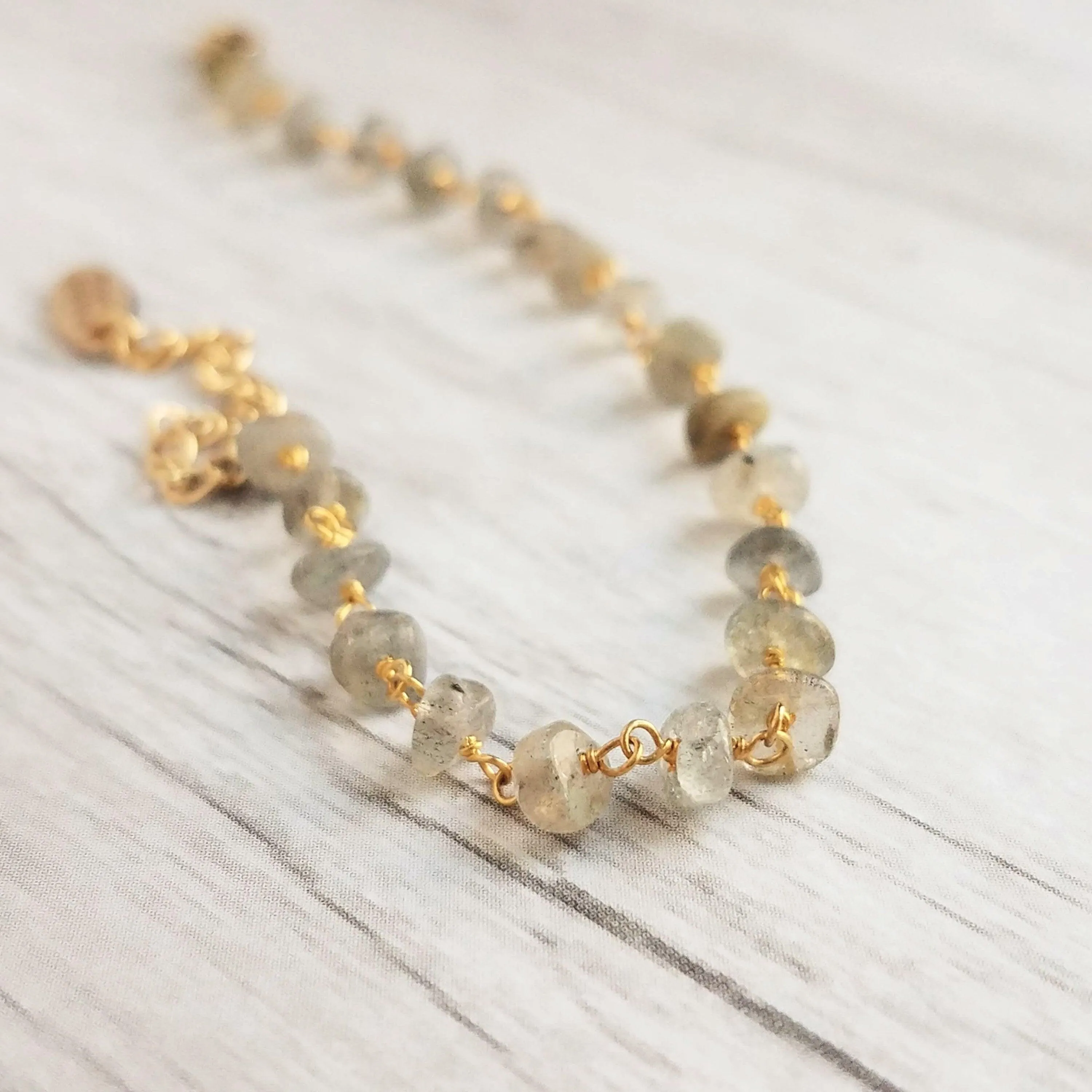 Labradorite Bracelet, tiny grey stone, semi precious gemstone, adjustable gold chain, vitreous iridescent blue green flash, spiritual symbol