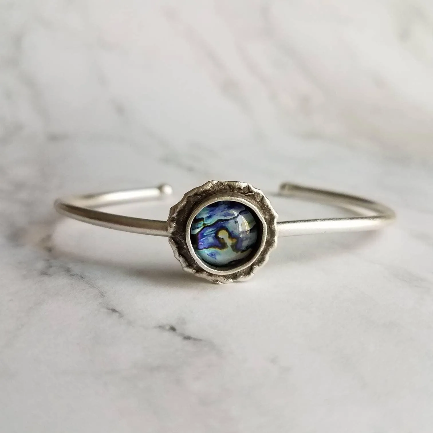 Silver Cuff Bracelet - oval open bangle w/ antiqued oxidized finish - thick simple wire w/ glass swirl ocean waves art in round deep bezel