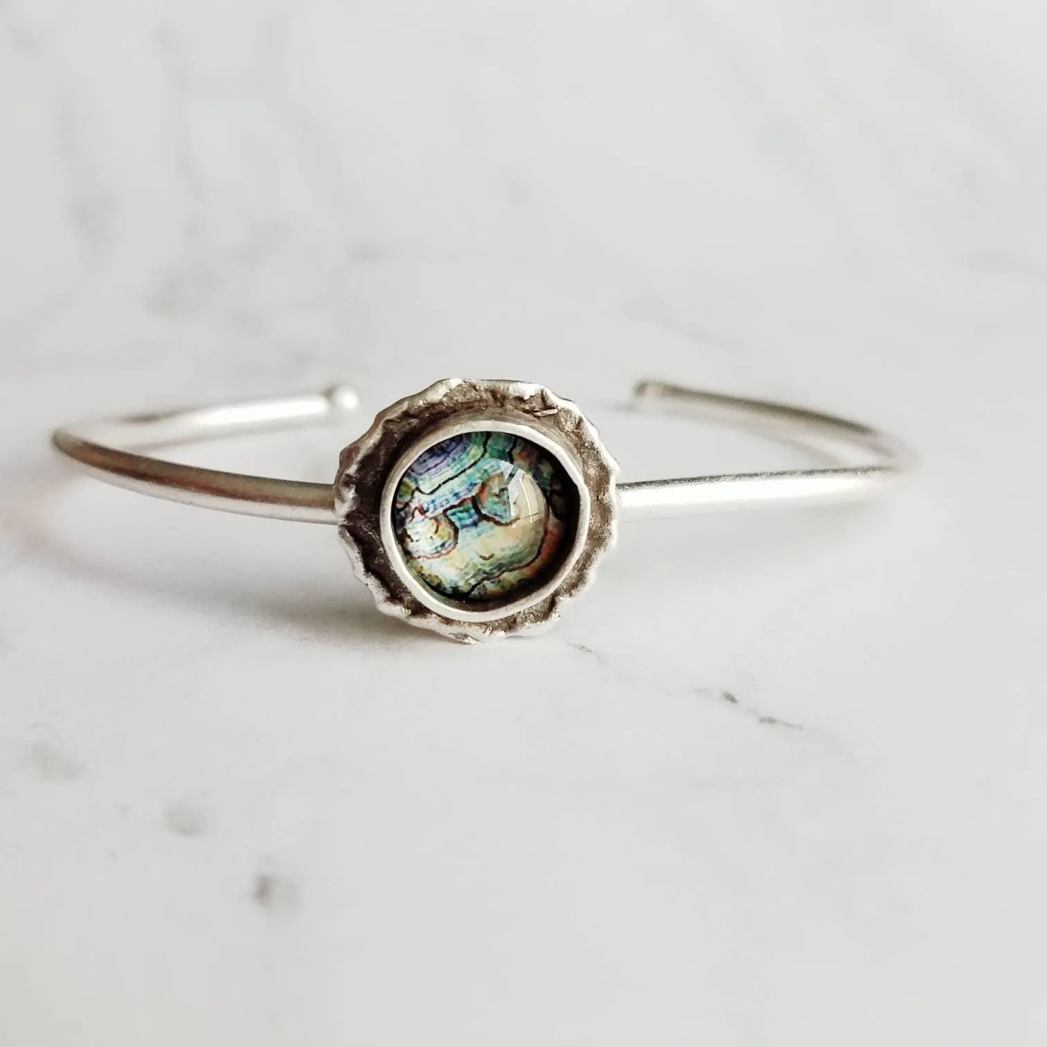 Silver Cuff Bracelet - oval open bangle w/ antiqued oxidized finish - thick simple wire w/ glass swirl ocean waves art in round deep bezel