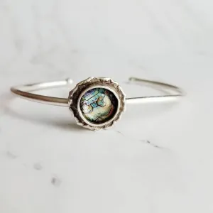Silver Cuff Bracelet - oval open bangle w/ antiqued oxidized finish - thick simple wire w/ glass swirl ocean waves art in round deep bezel