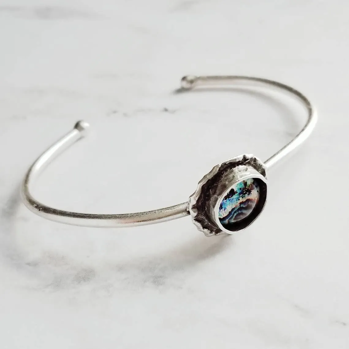 Silver Cuff Bracelet - oval open bangle w/ antiqued oxidized finish - thick simple wire w/ glass swirl ocean waves art in round deep bezel