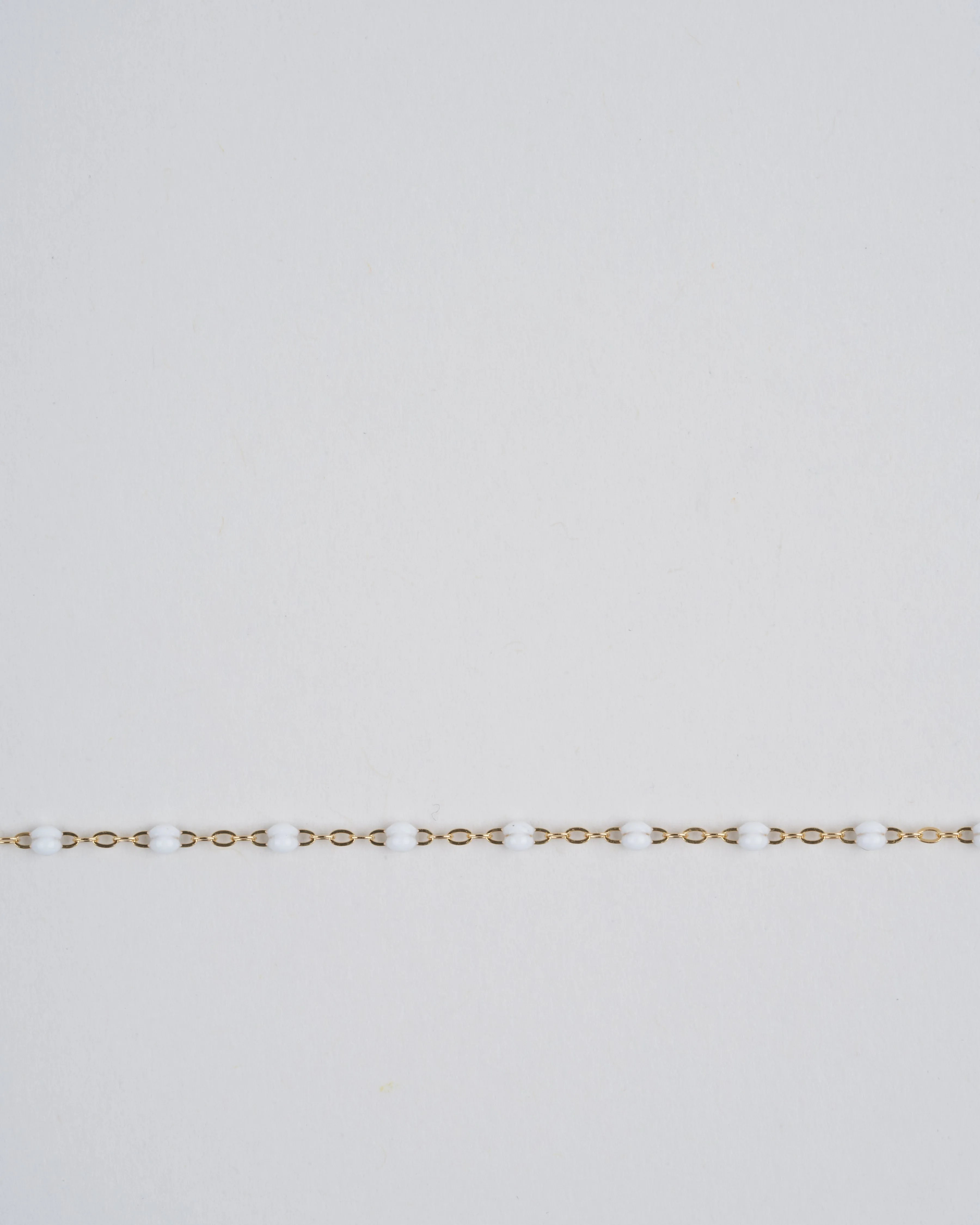 white bead bracelet  - yellow gold